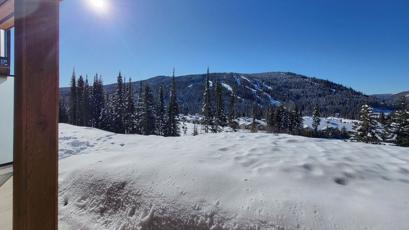 A snowy mountain landscape with a clear sky.