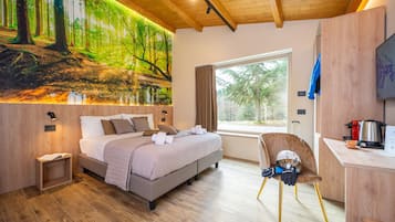 Deluxe Suite, Courtyard View | 1 bedroom, Frette Italian sheets, premium bedding, down comforters