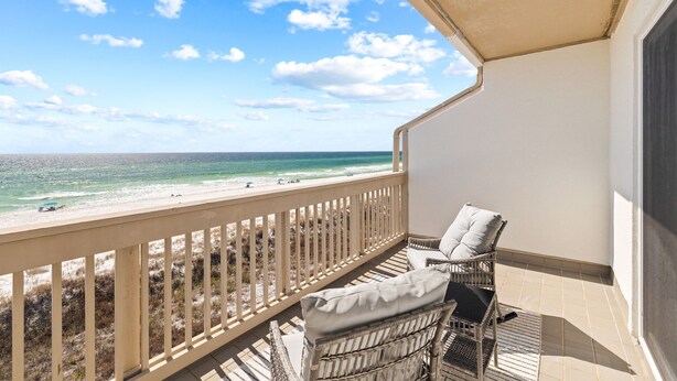 A balcony with a view of the beach and ocean. - Gulf-Front Retreat w/ Stunning Views, Private Beach Access, & Community Pool (Panama City Beach)