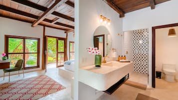 Deluxe Room, 1 King Bed, Balcony, Lagoon View | Bathroom | Shower, rainfall showerhead, hair dryer