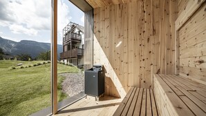 A modern wooden cabin with a glass door leading to a deck. - Ansitz Rungghof (Appiano Sulla Strada del Vino)