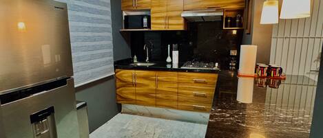 Fridge, microwave, stovetop, coffee/tea maker