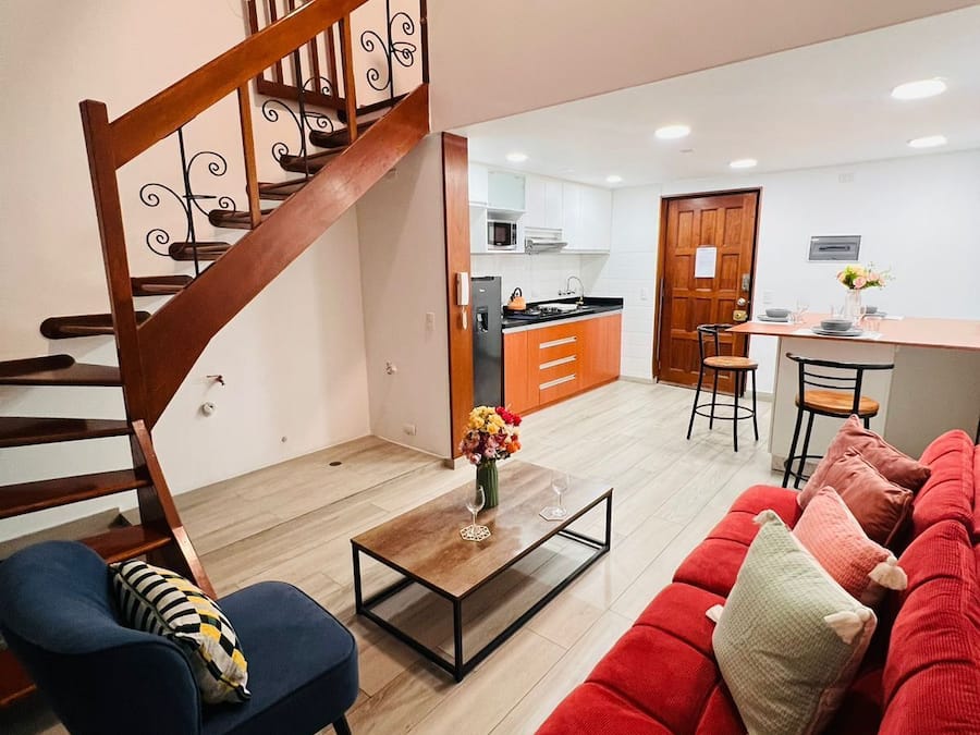 Deluxe Duplex | Living area | 60-inch Smart TV with digital channels, Netflix, pay movies