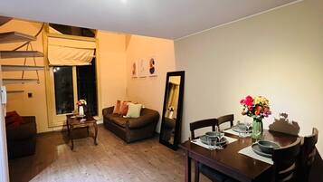 Superior Duplex | Living area | 60-inch Smart TV with digital channels, Netflix, pay movies