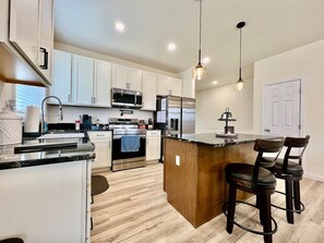Fridge, coffee/tea maker, cookware/dishes/utensils