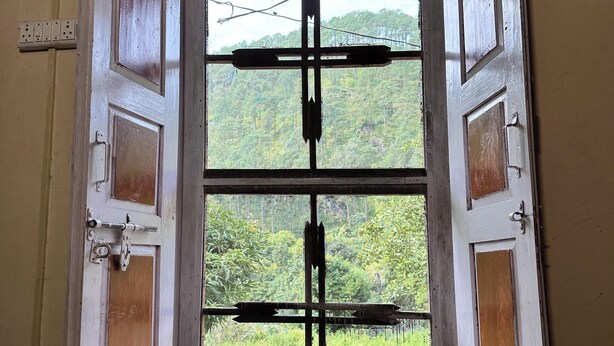 An open door with a view of greenery outside. - The Gazzaar Riverside camp (Nainital)