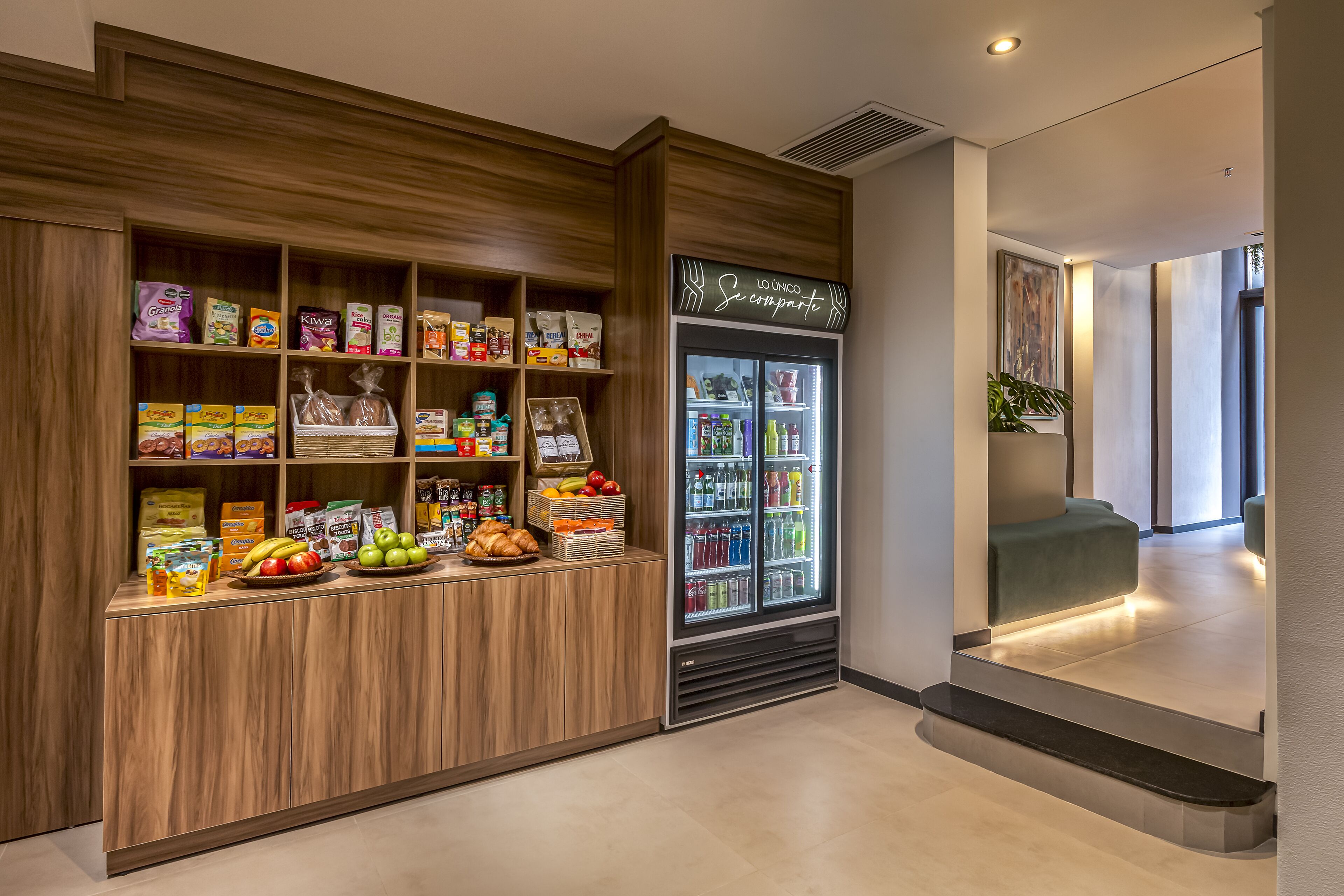 A snack bar with a variety of food items and a refrigerated display.