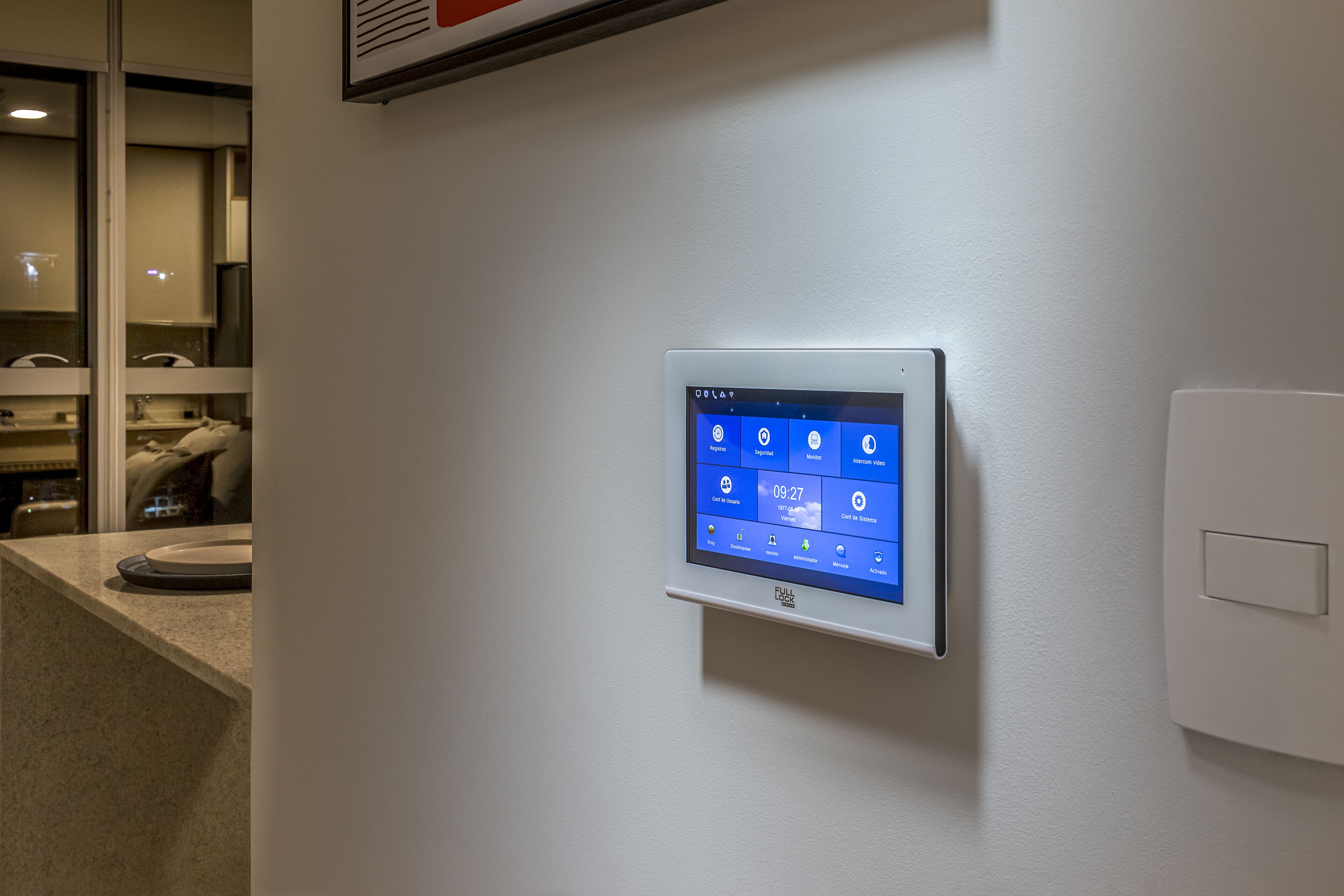 A digital control panel on a wall with various settings and a clock displaying 09:27.