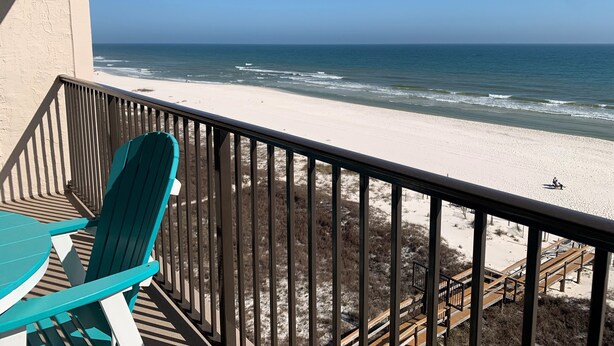 A balcony with a view of a beach and ocean. - Ocean Breeze 602W: Gulf-Front Perdido Key 2BR/2BA + Pool (Pensacola)