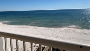 A beach view with a clear sky and calm sea. - SK511: Gulf-Front 3BR Corner Condo w/ Balcony (Pensacola)