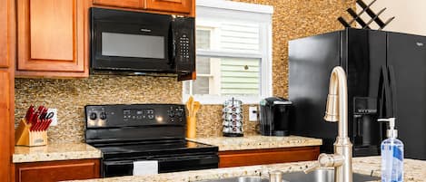 Coffee/tea maker, fridge, microwave, oven