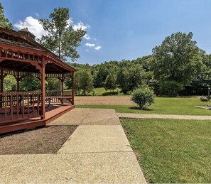 Situated in a serene outdoor setting, this gazebo offers a peaceful retreat.