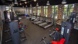 A gym with treadmills, stationary bikes, and weight machines. - Stunning 3Bd With Game Room @ Enclaves Resort 1021 (Davenport)