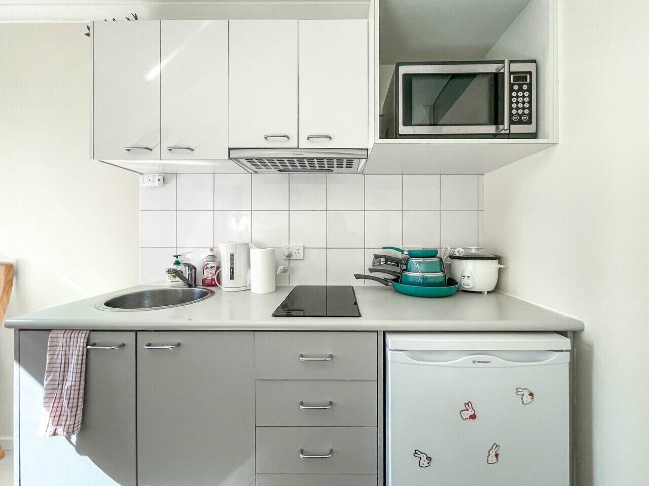 Fridge, microwave, stovetop, cookware/dishes/utensils