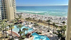 A resort with a beach, a swimming pool, and a high-rise building. - Beachfront Condo • Lagoon Pool • Sleeps 6 (Panama City Beach)