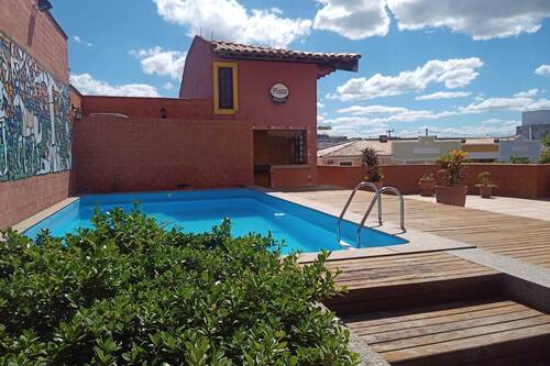 Outdoor pool, open 6:00 AM to 10:00 PM, pool umbrellas