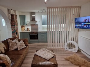 Apartment, 1 Bedroom | Living area | 32-inch LCD TV with digital channels