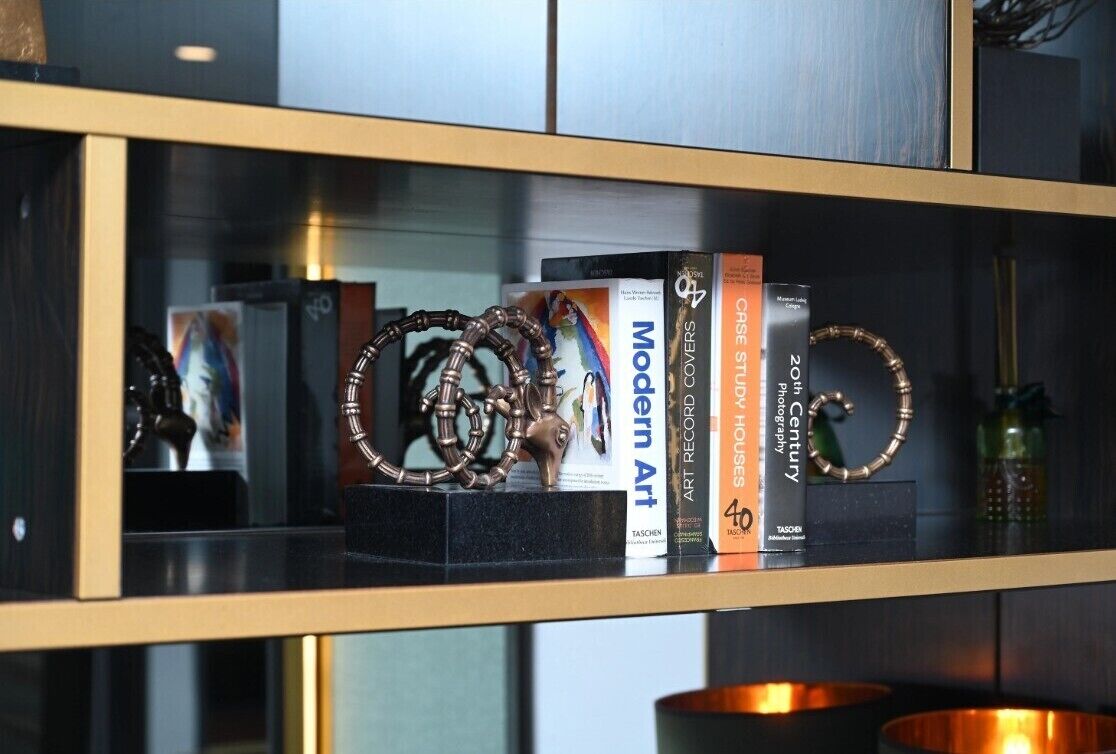 A bookshelf with books and decorative items.