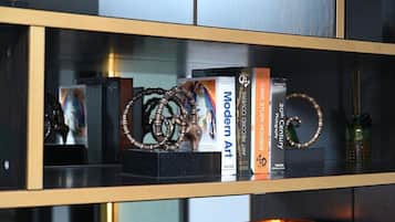 A bookshelf with books and decorative items.