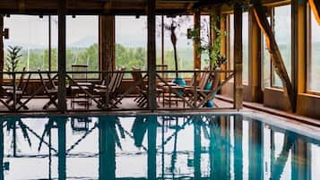 Indoor pool, open 7:00 AM to 9:00 PM, pool loungers
