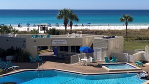 A pool area with a view of the beach and ocean. - Beachfront, clean, quiet, luxury condo on 3 rd fl amazing view! Walk to Tootsies (Panama City Beach)