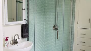 Shower, hair dryer, towels, soap