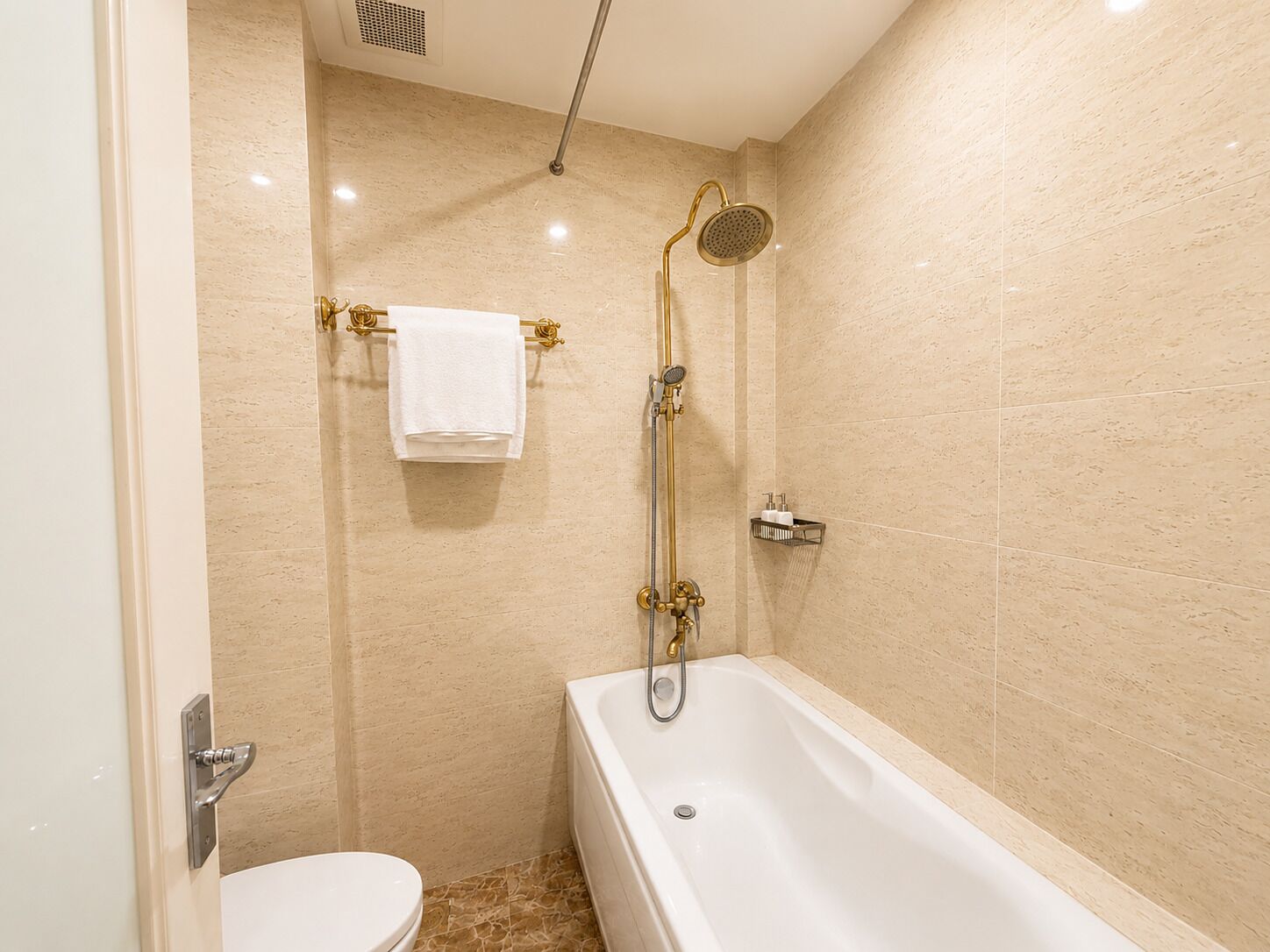 A bathroom with a bathtub, a shower, and a toilet.