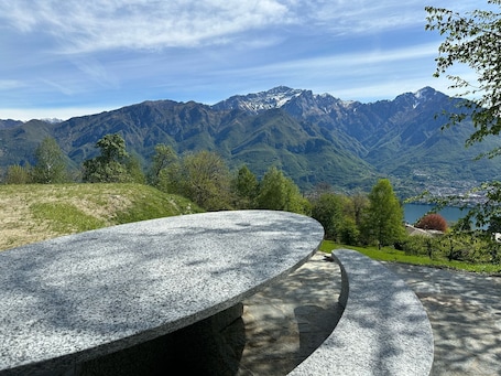 Outdoor dining. Apartment in Luxury Chalet “Baita Treeb Tramontana” with Lake View, Private Terrace in Civenna