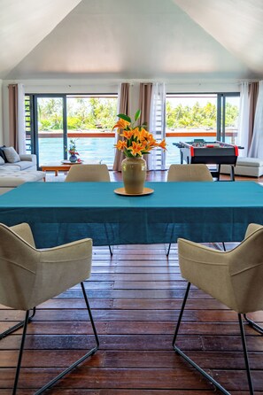 Villa Fara Nui | Living area | 190-cm flat-screen TV with cable channels, Netflix, foosball