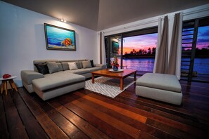Villa Fara Nui | Living area | 190-cm flat-screen TV with cable channels, Netflix, foosball - Motu Fara Private Island (Rangiroa)