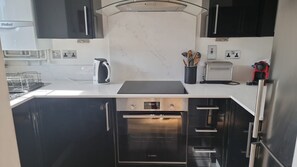Fridge, oven, coffee/tea maker, toaster