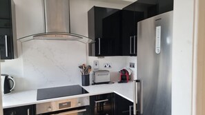 Fridge, oven, coffee/tea maker, toaster