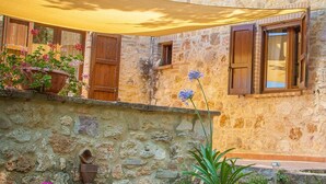 A stone building with wooden beams and white curtains. - Tra Cielo e Terra by Interhome (Todi)