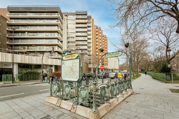 A street scene with a map sign, a no entry sign, and a pedestrian walkway.
