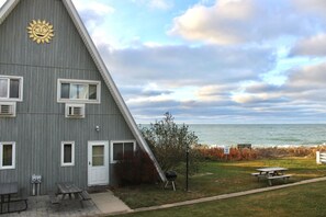 Outdoor dining - Lakefront Chalet #8 with Beach Access, Pools, Sport Courts, Fishing Pond & more! (Stevensville)