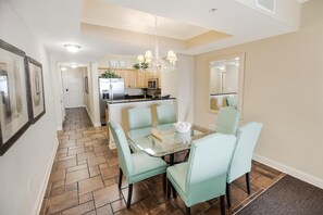 Enjoy cooking and dining in this well-equipped kitchen with a central island and adjacent dining area.