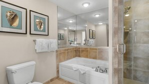 A bathroom with a toilet, a bathtub, and a shower area. - Relax and Unwind in this Oceanfront 1 Bdrm Condo (North Myrtle Beach)