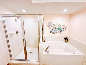 Shower, jetted tub, towels