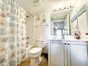 Shower, jetted tub, towels