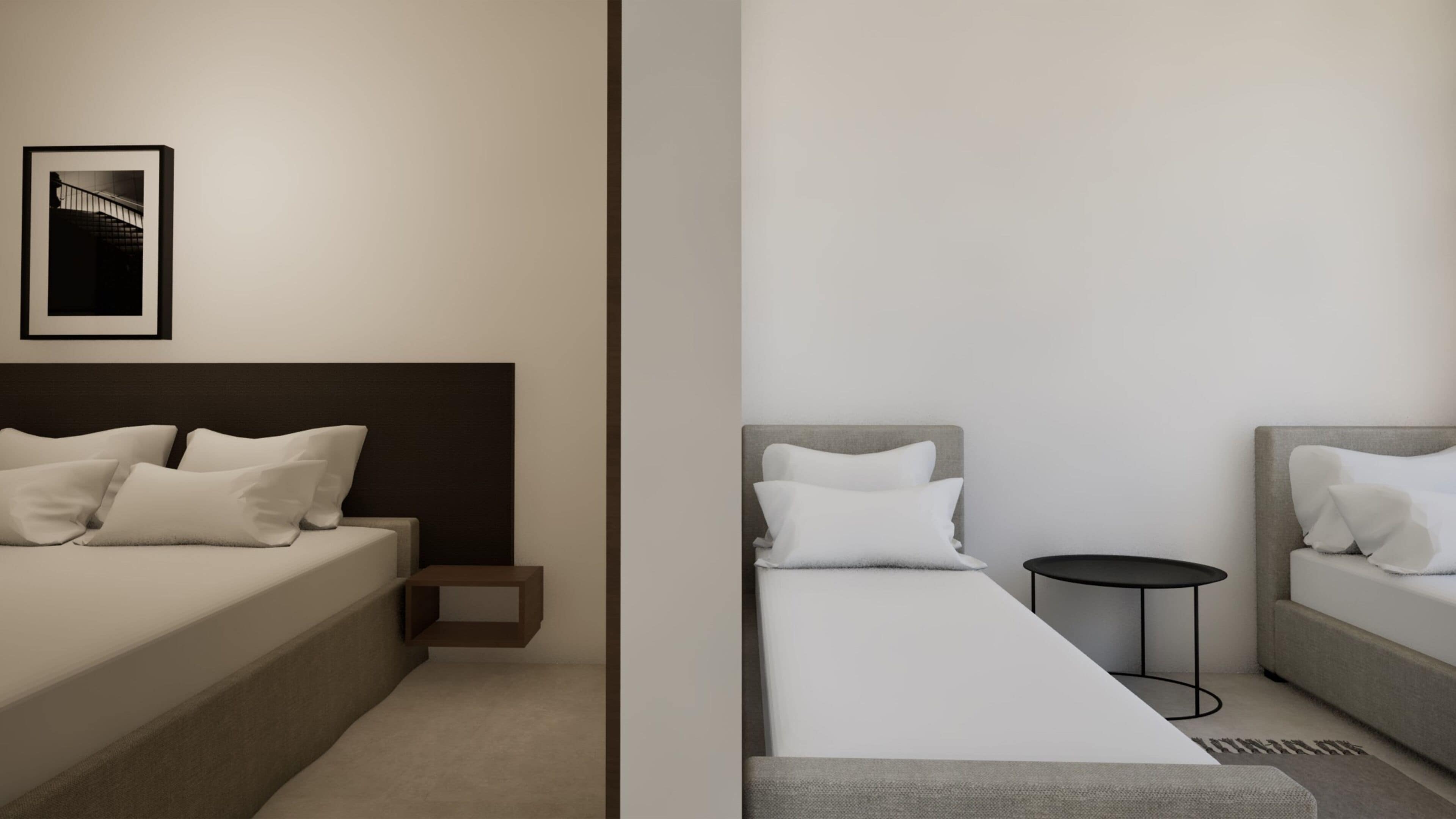A modern hotel room with a bed, bedside table, and a small round table.
