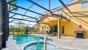 A swimming pool with a hot tub, outdoor seating, and a barbecue area. - 6 Bedroom W/Private Pool! Spa! Near Disney! (Davenport)