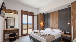 A modern bedroom with a bed, bedside table, and a large mirror. - Suites Olive Tree Farm Episkopi Village (Rethymno)