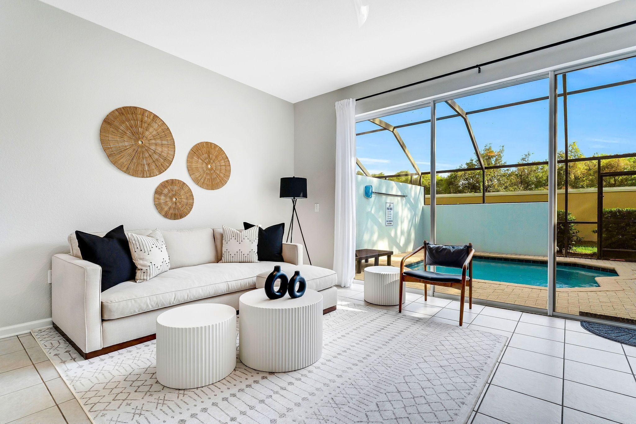 Indoor-Outdoor Living, Open-concept great room with sliding glass doors to private lanai and pool