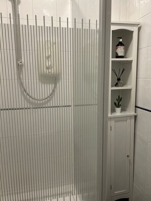 Shower, hair dryer, towels, soap