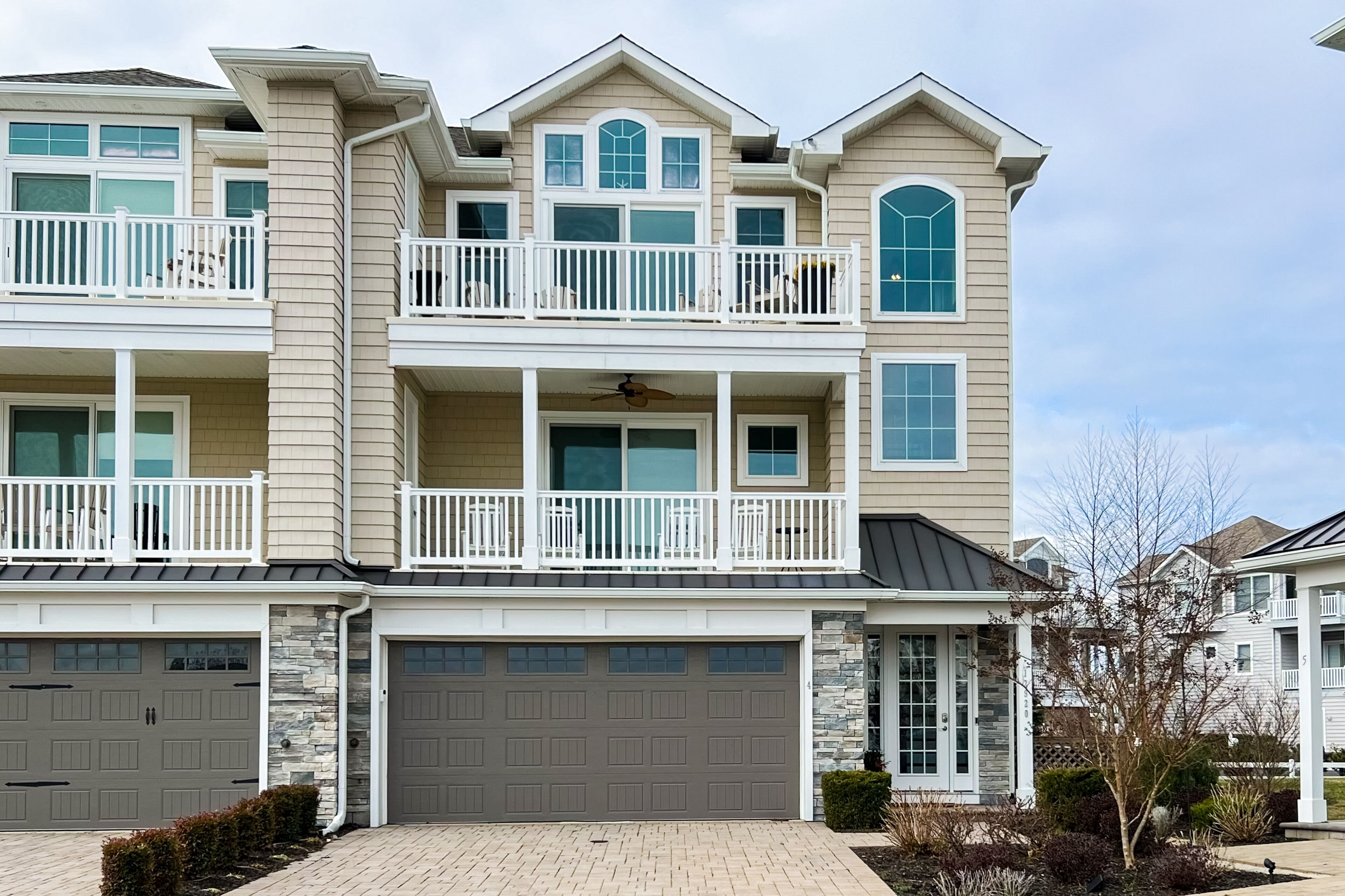 Luxurious coastal getaway with multiple balconies, patio, & stunning ocean views
