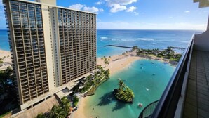 A high-rise hotel with a view of a beach and ocean. - Waikiki | Marina District Stay | Beach & Resort Pools (Honolulu Oahu)