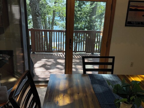 Beautiful beachfront chalet with southern exposure on Green Lake,Dedham, Maine.
