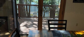 Beautiful beachfront chalet with southern exposure on Green Lake,Dedham, Maine.