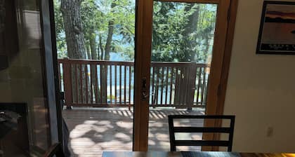 Beautiful beachfront chalet with southern exposure on Green Lake,Dedham, Maine.