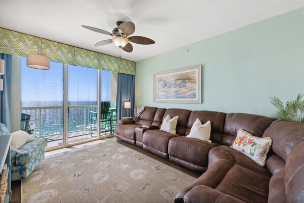 Deluxe Condo | Living area | 42-inch Smart TV with premium TV channels, DVD player